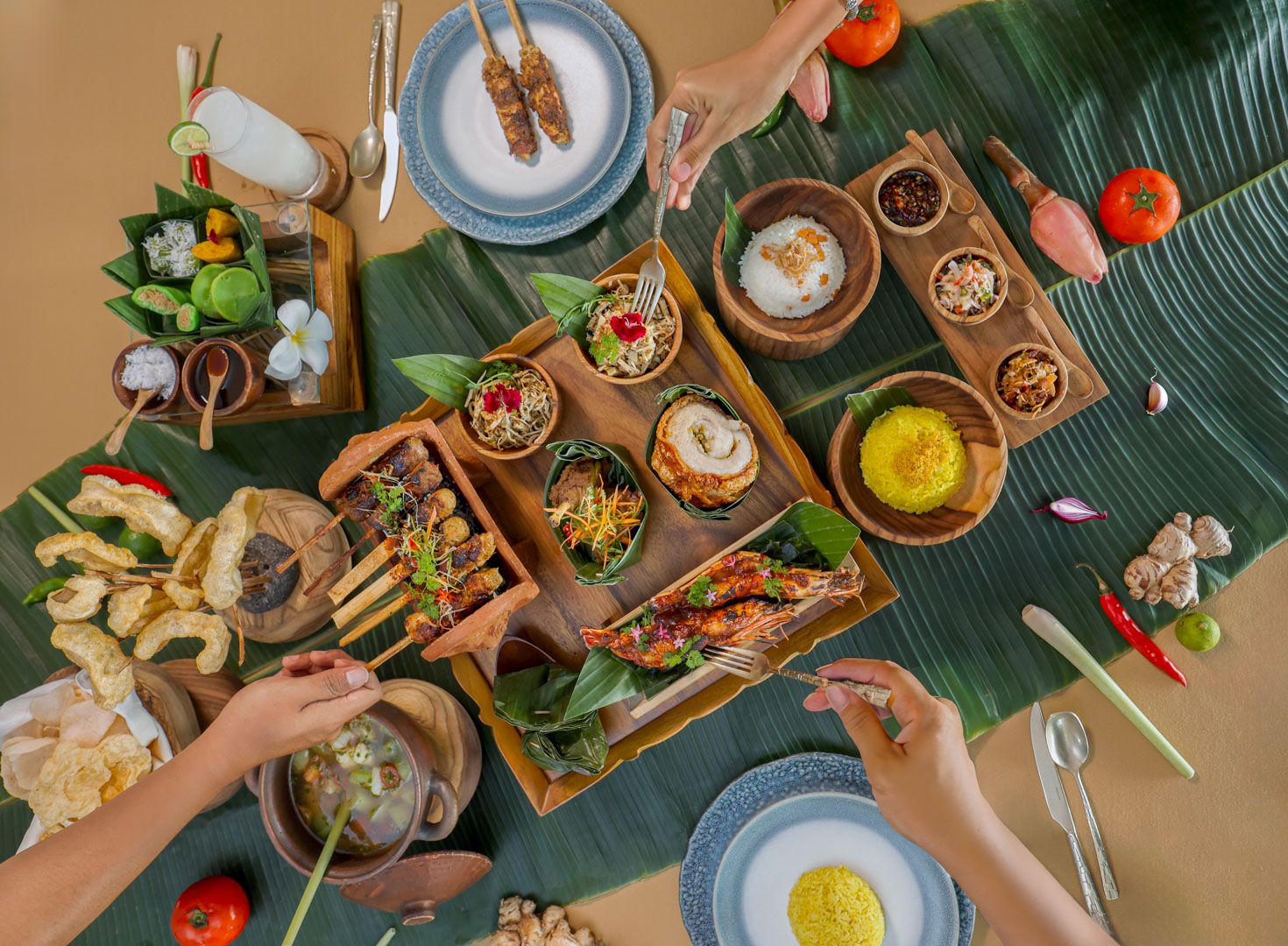 Segaran Dining Terrace at Jumeirah Bali honours local culinary tradition through its Megibung feast presentation