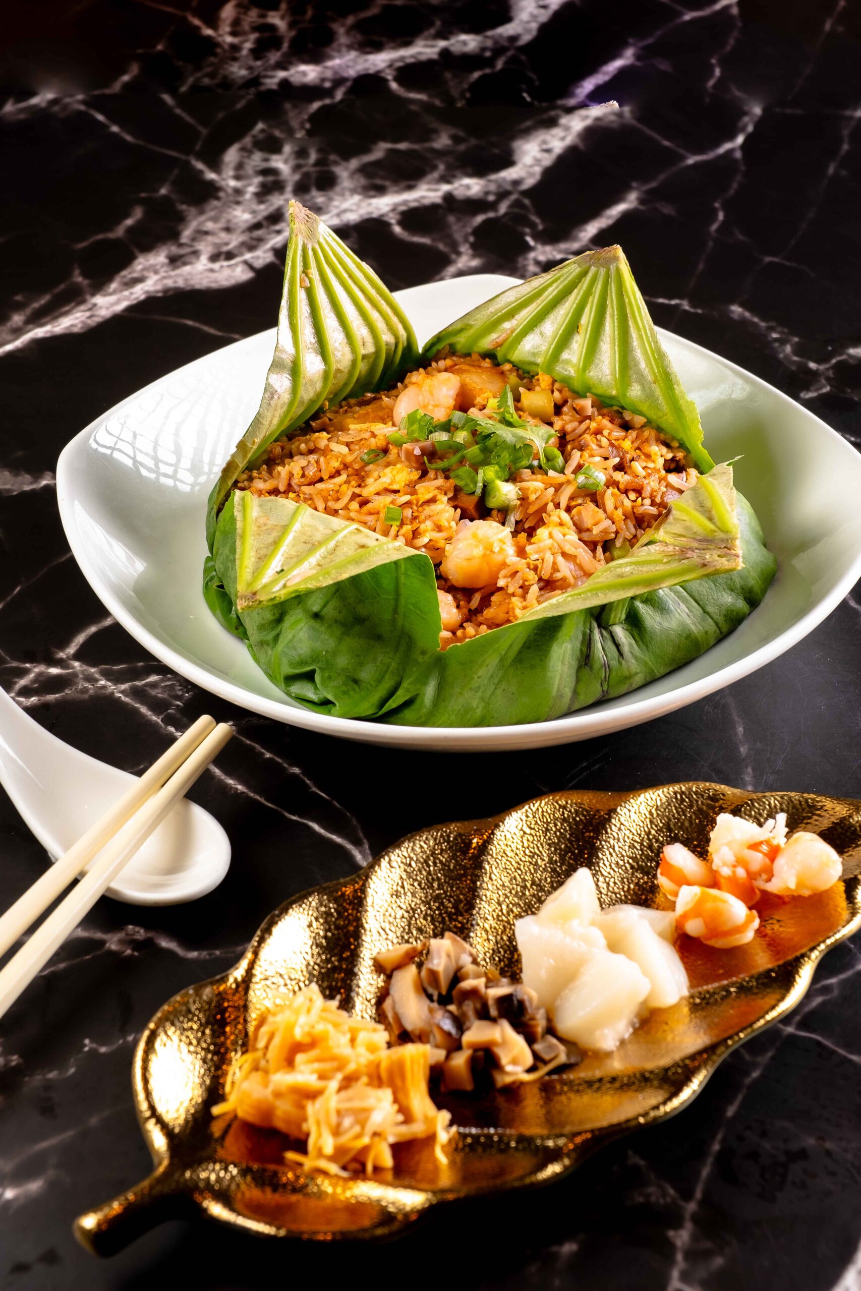 Asia Grand Singapore's dish covered in a lotus leaf.