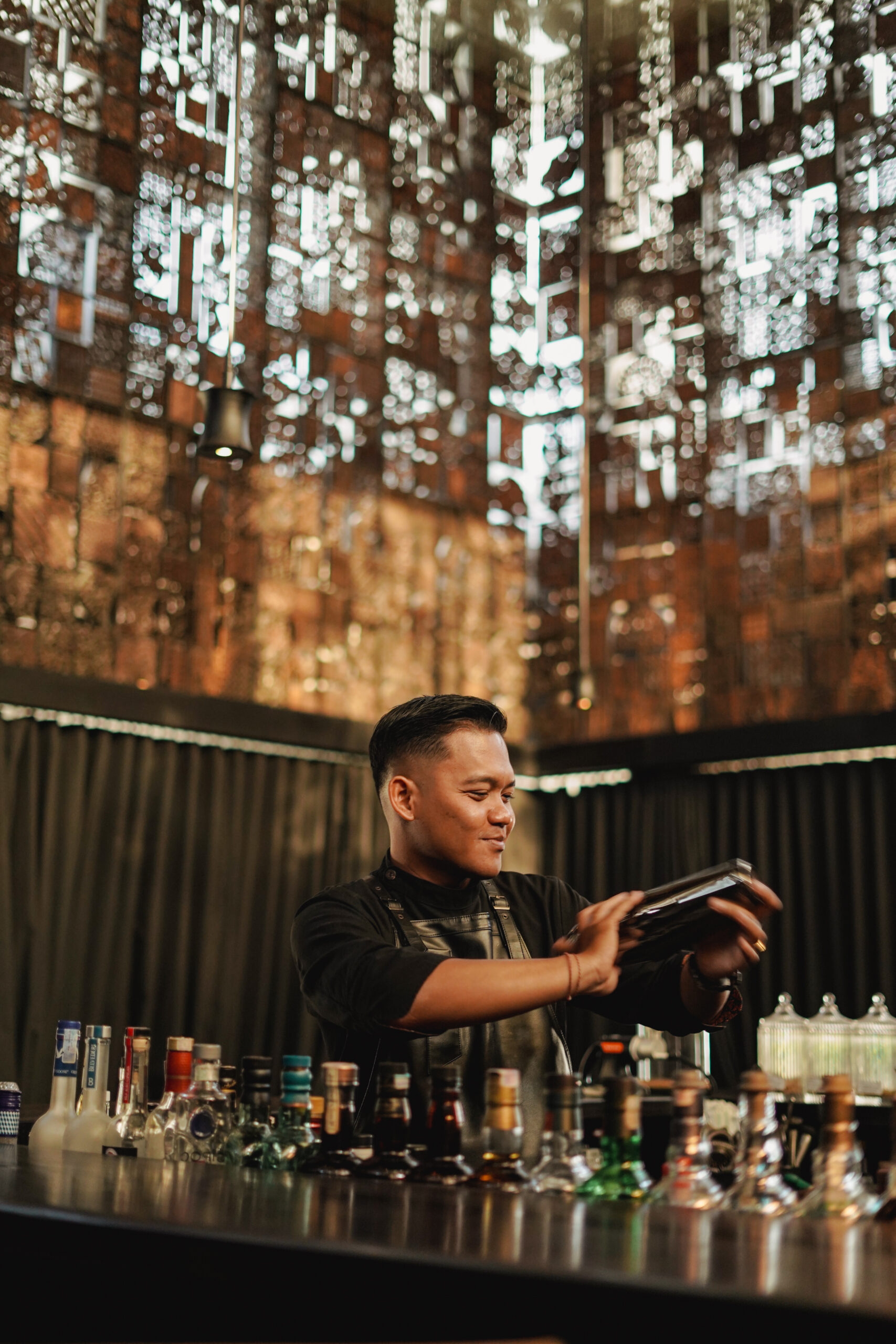 Saptha behind the bar of Batique
