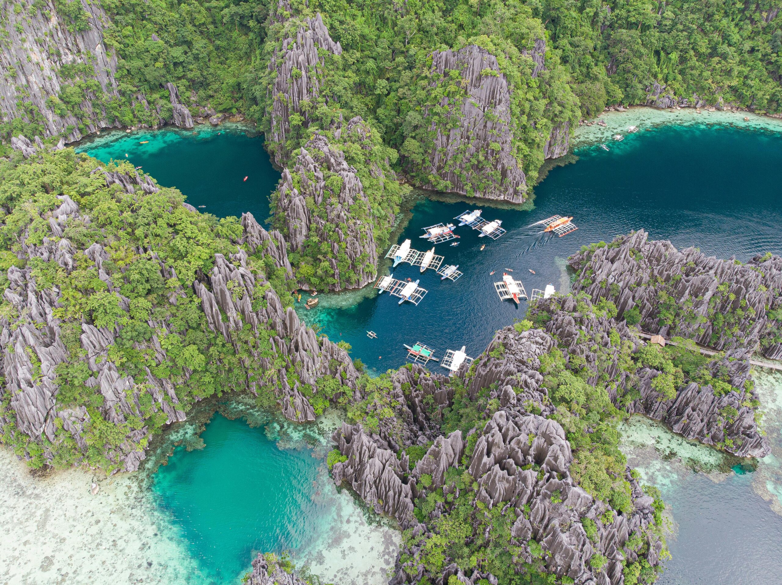 Limestone cliffs and turquoise lagoon in the Bacuit Archipelago El Nido Palawan